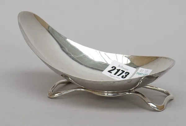 A silver dish, of abstract oval form, raised on an integral shaped rectangular stand, length 18cm by A.E. Jones, Birmingham 1959, weight 192 gms, toge