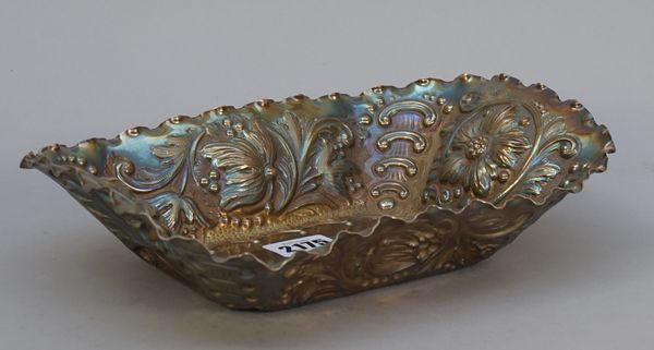 A Victorian silver shaped rectangular basket, with bold floral, foliate and scroll embossed decoration, London 1889, length 24.5cm, weight 280 gms. Il