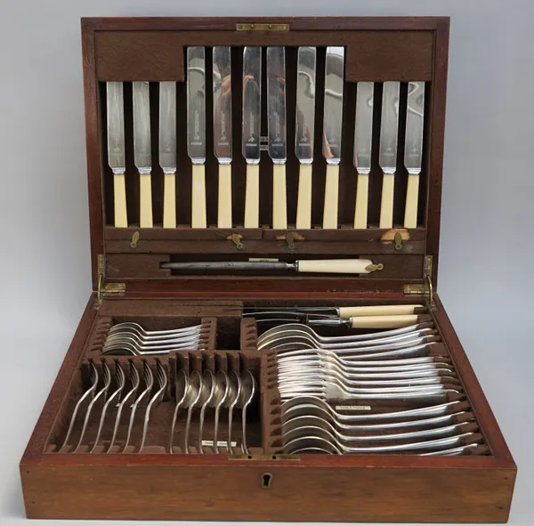 An Old English pattern canteen of plated table flatware, comprising; six soup spoons, six table forks, four serving spoons, six dessert spoons, six de