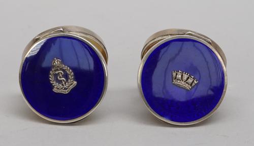 A lady's silver and enamelled circular hinge lidded powder compact, fitted with a mirror within, the lid applied with a badge of The Royal Army Medica