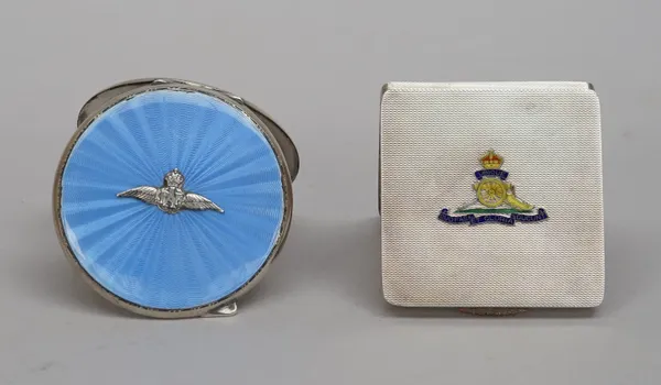 A silver and enamelled lady's square powder compact, fitted with a mirror within, the lid enamelled with the badge of The Royal Artillery, on an engin