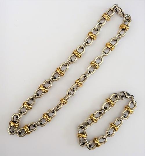 A Kiki McDonough silver and gilt bracelet, in a woven and loop shaped design, on a sprung hook shaped clasp, weight 46 gms and a neckchain in a simila