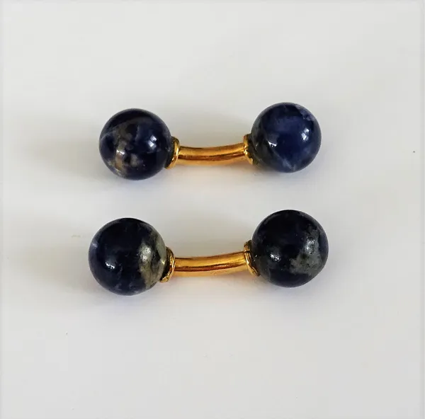 A pair of French gold mounted lapis lazuli cufflinks, each with a lapis lazuli bead to the back and to the front, connected by a curved bar.