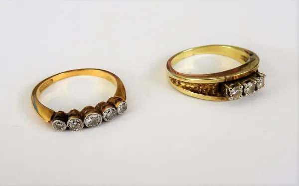 A gold and platinum, diamond set five stone ring, collet set with a row of cushion shaped diamonds, graduating in size to the centre stone, detailed 1