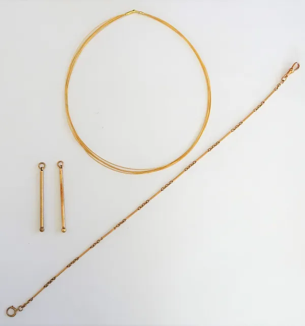 An 18ct gold necklace, in a seven row wirework design, weight 8.7 gms, a gold toothpick, detailed 9 CT, a gold toothpick, with engine turned decoratio