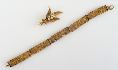 A gold and cultured pearl brooch, designed as a spray of heather, detailed 9 CT, gross weight 4.3 gms, with a case and a gilt filigree bracelet, in a