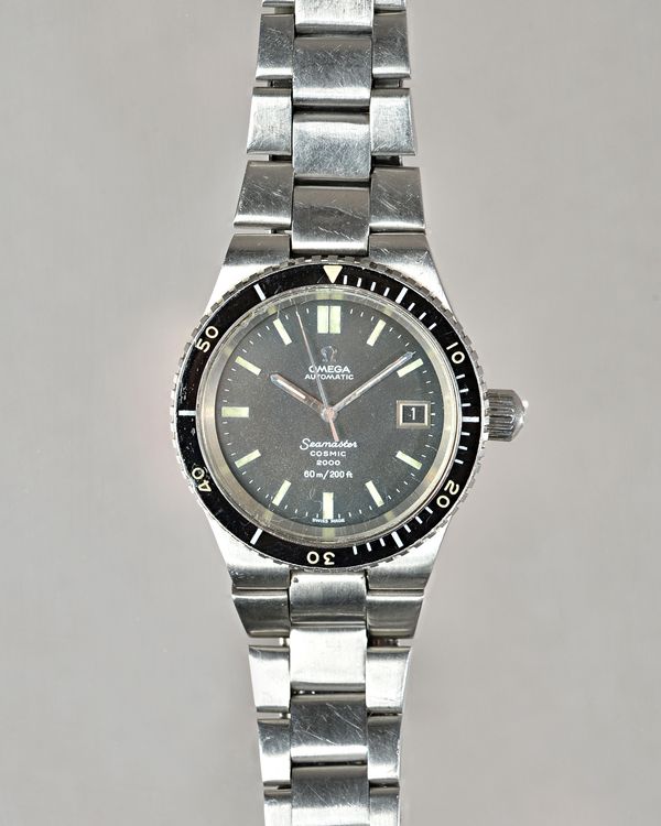 An Omega Automatic Seamaster Cosmic 2000 gentleman's steel bracelet wristwatch, the signed black dial with luminous baton numerals, date of the month