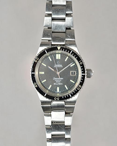 An Omega Automatic Seamaster Cosmic 2000 gentleman's steel bracelet wristwatch, the signed black dial with luminous baton numerals, date of the month