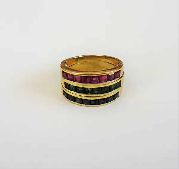 A gold, sapphire, emerald and ruby ring, mounted with a row of square cut sapphires, a row of square cut emeralds and with a row of square cut rubies,