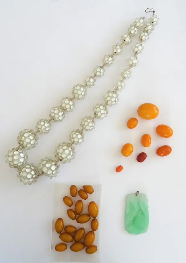 A single row necklace of graduated spherical bobbly glass beads, a carved and treated jade pendant and a quantity of loose beads, including approximat