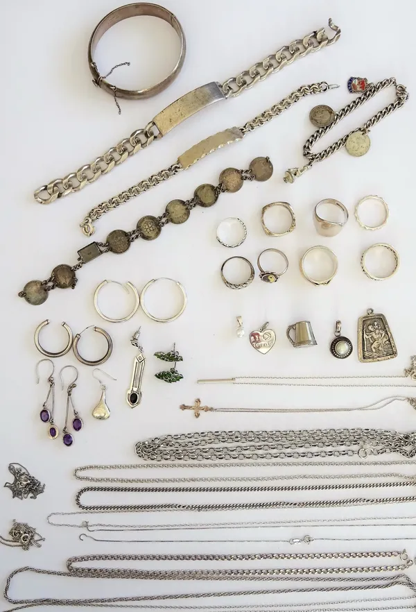 Mostly silver jewellery, comprising; two identity bracelets, two further bracelets, two pendnats with neckchains, ten further neckchains, four pairs o