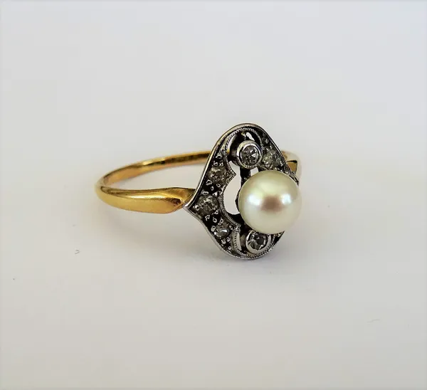 A gold, diamond and cultured pearl ring, in a pierced shaped oval design, mounted with the single cultured pearl to the centre, in a surround of eight