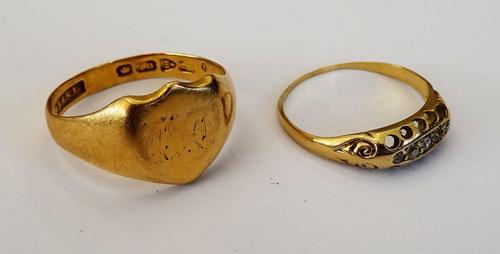 An 18ct gold shield shaped signet ring, Chester 1911, ring size S, weight 3.7 gms. and a gold, diamond and colourless gem set ring (worn) ring size N,