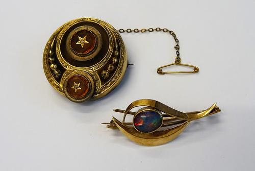A Victorian gold, seed pearl and yellow gem set brooch, of circular form, the back glazed with a hair locket compartment and a gold brooch, mounted wi