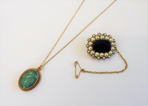 A gold, half pearl set and dark blue enamelled shaped rectangular brooch, fitted with a safety chain and a 9ct gold mounted oval green stone pendant,
