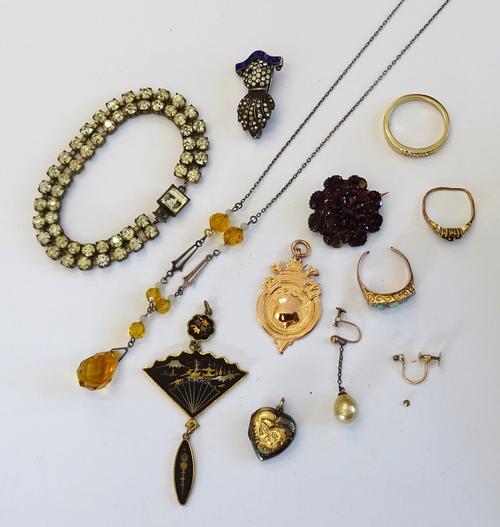 A 9ct gold fob medal, a 9ct gold and opal five stone ring, a 9ct gold, sapphire and diamond set ring (one sapphire lacking), combined gross weight 6.4