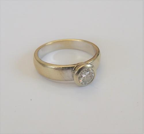 A white gold and diamond single stone ring, collet set with a circular cut diamond, the diamond weighs approx 0.50cts, ring size L, gross weight 4.6 g