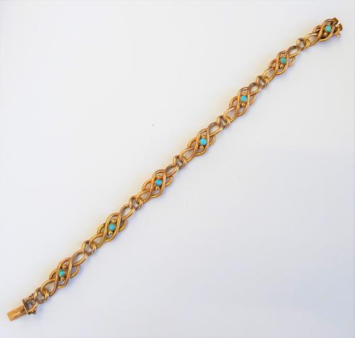 A gold and turquoise bracelet, in an entwined, beaded and curb link design, mounted with seven turquoise at intervals, length 20.2cm, gross weight 16.