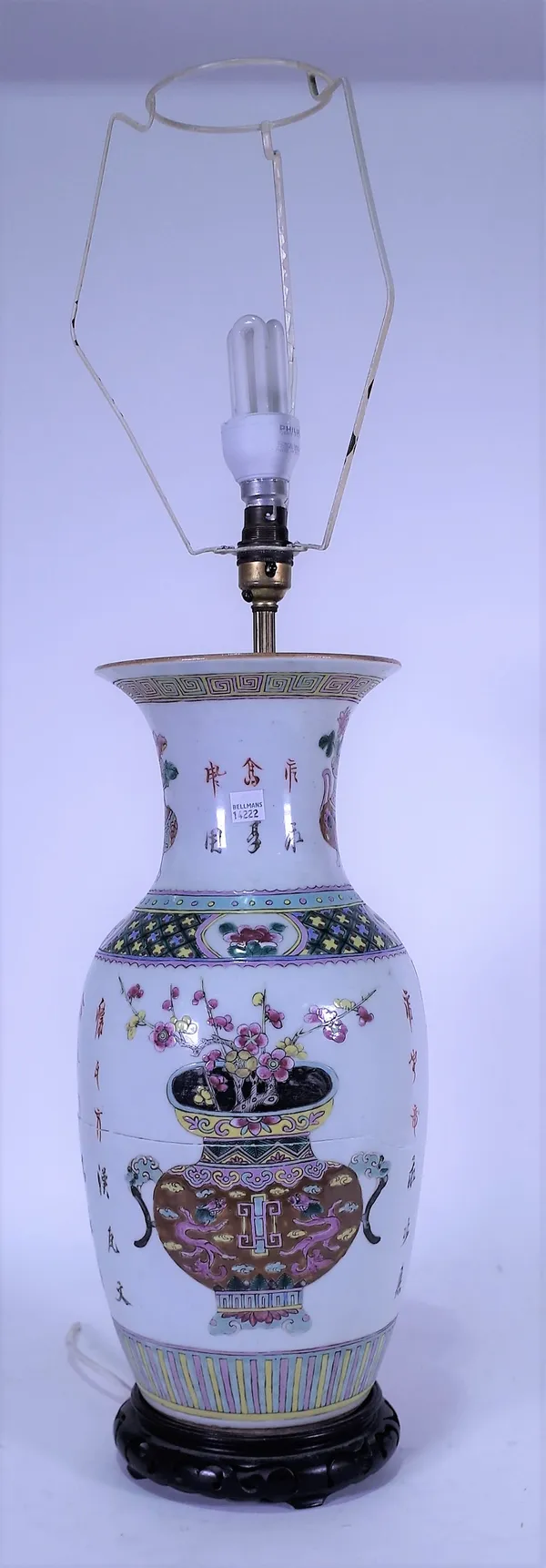 A 20th century Chinese vase, later converted to a table lamp, with floral decoration, character marks, 48cm high, a later hardwood stand.