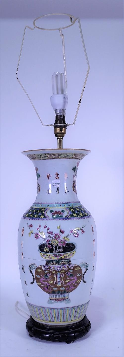 A 20th century Chinese vase, later converted to a table lamp, with floral decoration, character marks, 48cm high, a later hardwood stand.