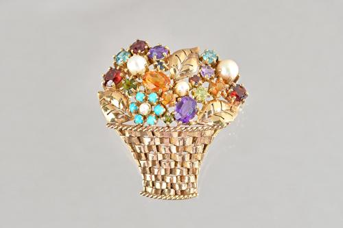 A 9ct gold and gem set brooch, designed as a basket of flowers, mounted with blue zirzon, amethyst, turquoise, garnet, other gemstones and cultured pe