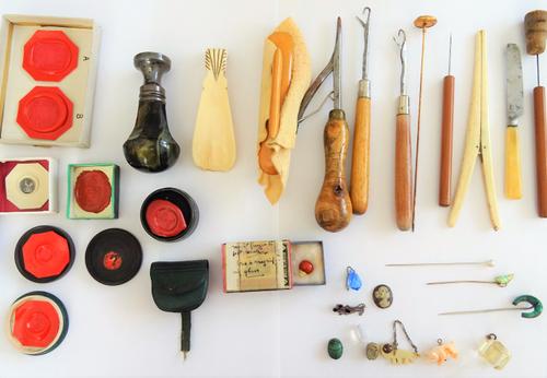 A hawk's eye desk seal, crest engraved, three stick pins, a silver and black enamelled brooch, designed as Mickey Mouse, a quantity of wax seal impres