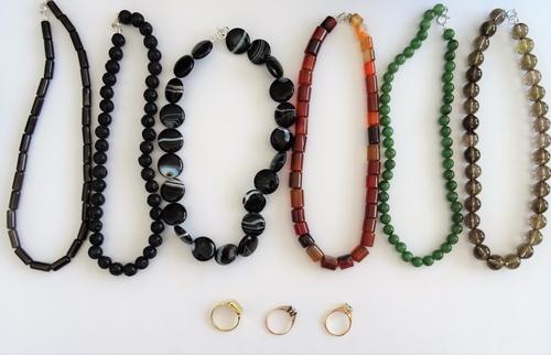 A 9ct gold rectangular signet ring, a 9ct gold and circular cut colourless gem set solitaire ring, with bark textured shoulders, a 9ct gold and oval c