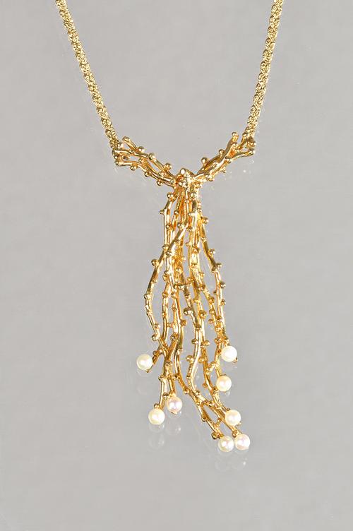 A 9ct gold and seed pearl necklace, in an abstract design, having beaded decoration, import mark London 1970, on a sepentine link neckchain, having a
