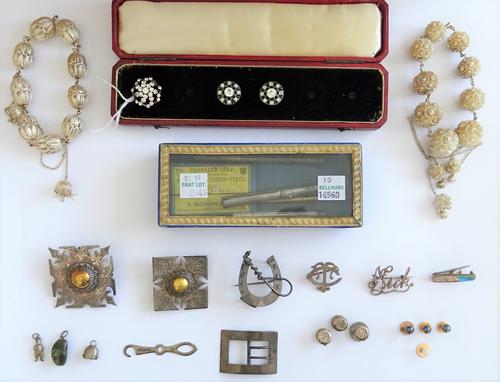 A group of mostly silver jewellery, comprising; two filigree bracelets, six brooches, a pair of colourless paste set buttons, another colourless paste