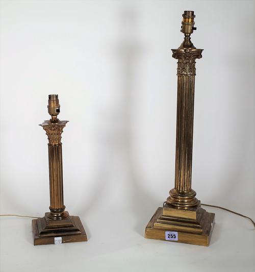 A 20th century brass table lamp formed as a Corinthian column on plinth base, 48cm high, and another smaller, 30cm high, (2).