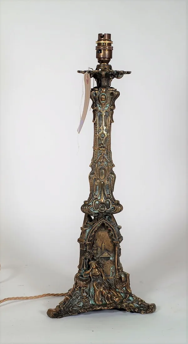 A Victorian brass table lamp with a figural embossed scene to the base, 53cm high.