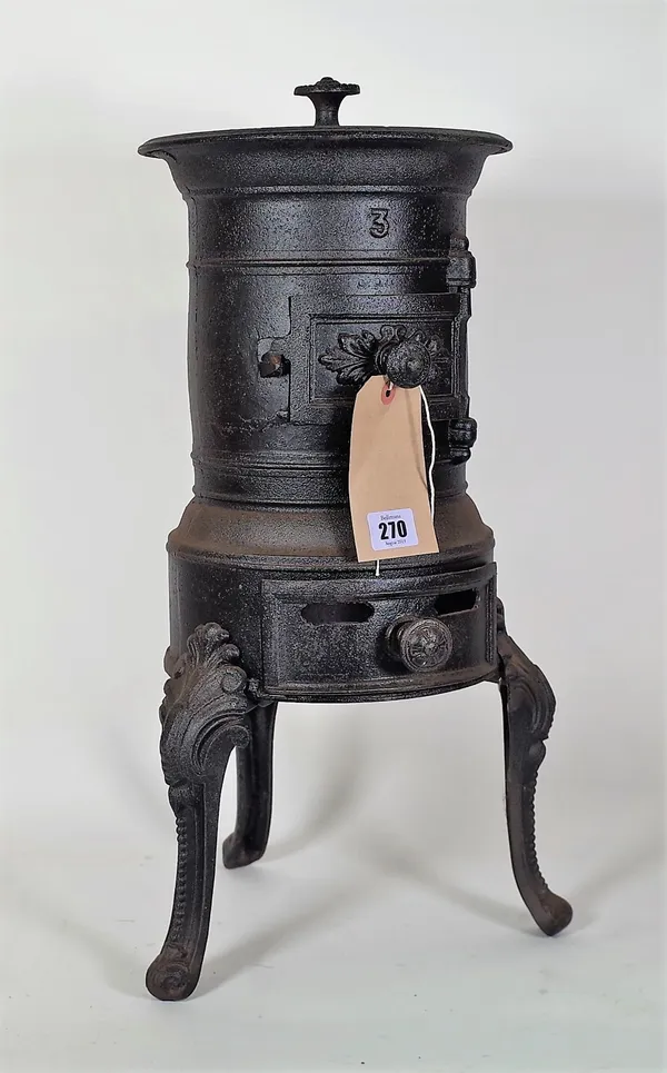 A 20th century French cast iron stove, 54cm high.