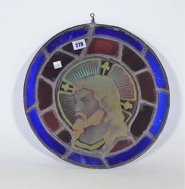 A 20th century small circular stained glass window depicting Jesus, 34cm wide.