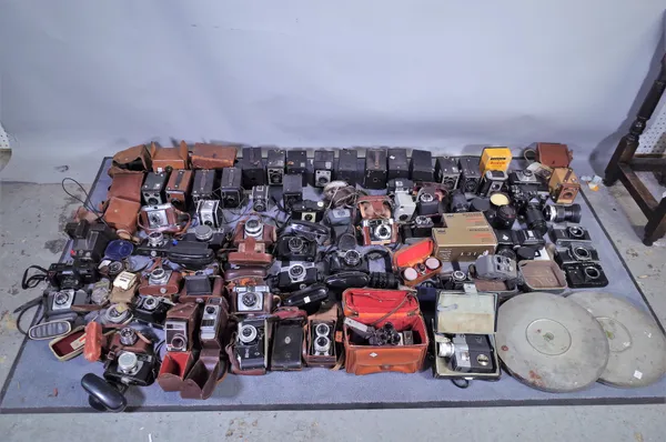 Photographic interest, including; a large quantity of Vintage cameras, lenses and equipment, Voightlander, Minolta, various folding cameras, Nikon, Pe