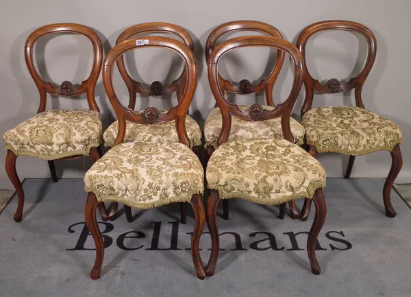 A set of six Victorian mahogany balloon back dining chairs on cabriole supports (6).