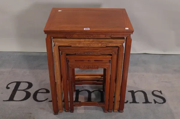 A 20th century Chinese hardwood nest of four tables, the largest 50cm wide x 67cm high.