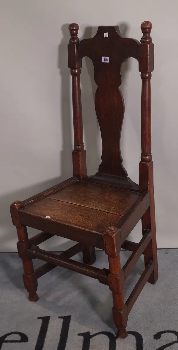 A pair of early 18th century and later oak vase back side chairs, (2).