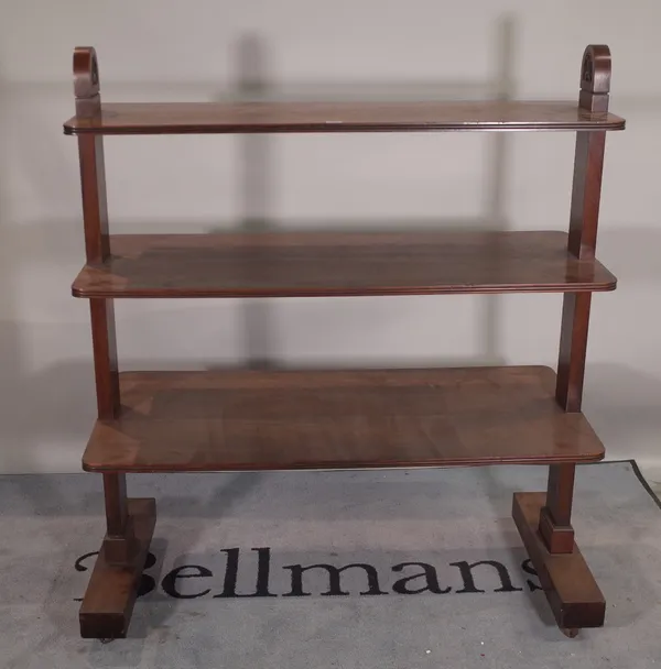 An early 20th century mahogany three tier graduated buffet, 115cm wide x 53cm deep x 135cm high. Provenance; property from the late Sir David Tang Thi