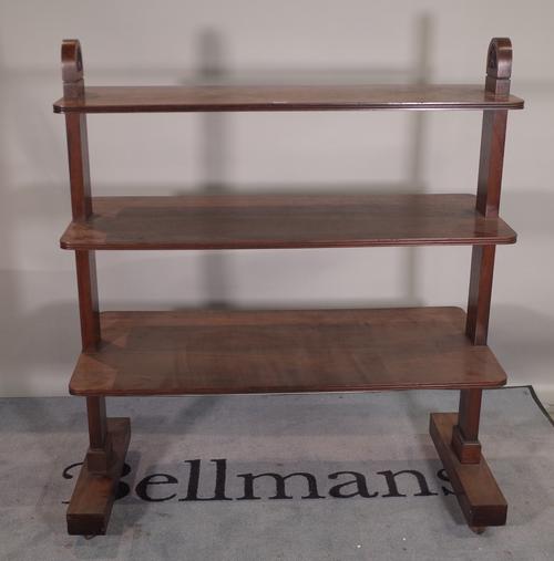 An early 20th century mahogany three tier graduated buffet, 115cm wide x 53cm deep x 135cm high. Provenance; property from the late Sir David Tang Thi