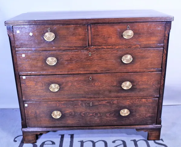 A George III and later oak chest of two short and three long graduated drawers on bracket feet 114cm wide x 101cm high.