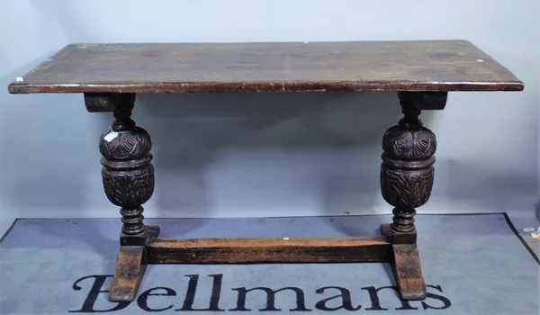 An 18th century oak refectory table on bulbous supports, 147cm wide x 76cm high.