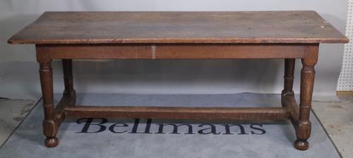 A late 18th century oak refectory table on turned supports united by 'H' frame stretcher, 187cm wide x 73cm high.