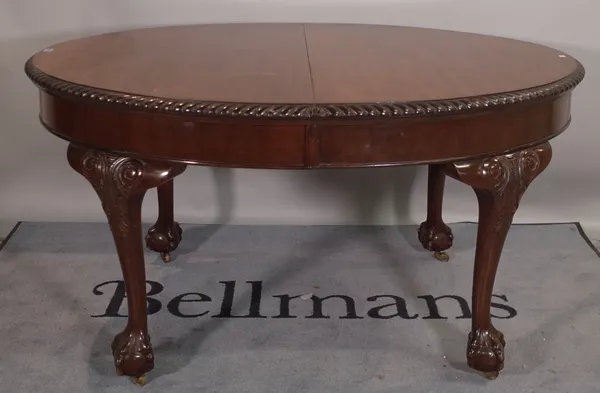 A Victorian mahogany oval extending dining table with two extra leaves on ball and claw feet, 150cm wide x 78cm high, 210cm fully extended.