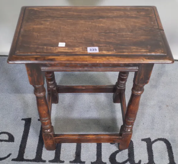 A 18th century and later oak joint stool on ring turned supports, 45cm wide x 55cm high, and a 19th century and later oak joint stool, 48cm wide x 57c