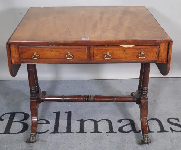 A Regency inlaid mahogany sofa table with a pair of frieze drawers on turned columns and four downswept supports, 78cm wide x 73cm high.