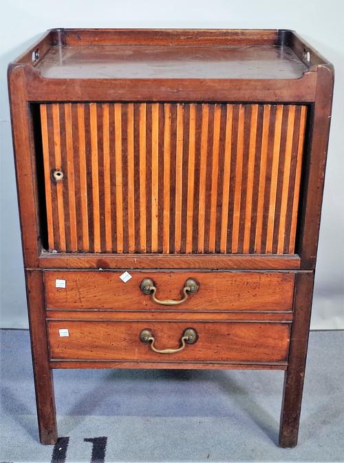 A George III mahogany tambour fronted commode, with galleried top, on block supports, 56cm wide x 83cm high.