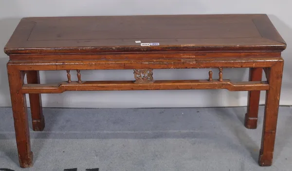 A late 19th century hardwood Chinese low altar table, with turned frieze on block supports, 98cm wide x 51cm high.