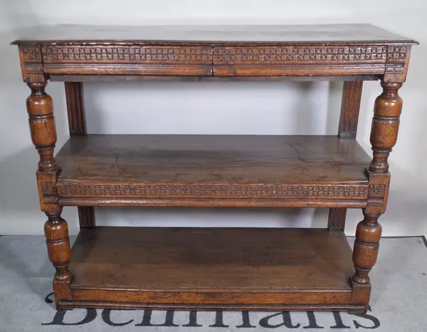 A 17th century and later oak tridarn / three tier serving buffet with three frieze drawers on cup and cover supports, 123cm wide x 99cm high.