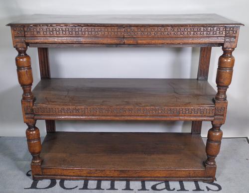 A 17th century and later oak tridarn / three tier serving buffet with three frieze drawers on cup and cover supports, 123cm wide x 99cm high.