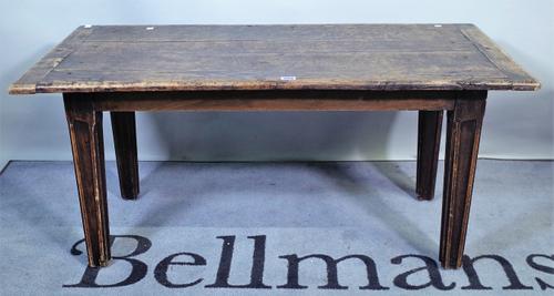 A 19th century and later oak coffee table on fluted tapering supports, 111cm wide x 52cm high.